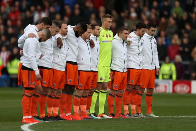 Sheffield Utd line up for a minutes silence during the English League One match at the Proact Stadium, Chesterfield. Picture date: November 13th, 2016. Pic Simon Bellis/Sportimage