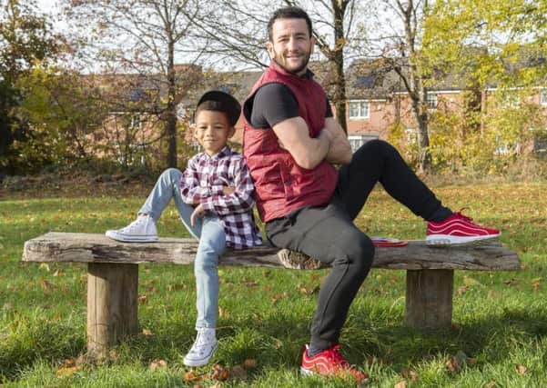 Sheffield boxer Sam Sheedy relaxes with his step son Naffel in the park ahead of his British title fight