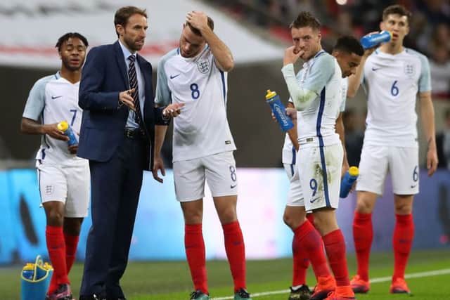 England caretaker manager Gareth Southgate (left) gives instructions to England's Jordan Henderson from the touchline during the International Friendly at Wembley Stadium, London. PRESS ASSOCIATION Photo.