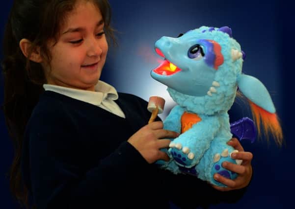 9 Nov 2016...Meadowhall Shopping Centre launch the Christmas Dream Toys for 2016.Danjana Curejova with Torch My Blazing Dragon. Picture Scott Merrylees