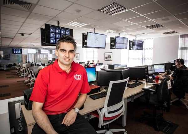 Director Arnie Singh in City Taxi's Don Valley call centre