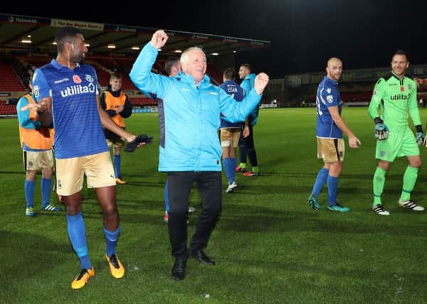 Eastleigh manager Ronnie Moore celebrates their victory over Swindon Town in the FA Cup First Round Replay at the County Ground, Swindon. PRESS ASSOCIATION Photo.