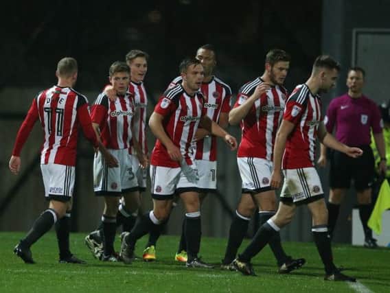 Sheffield United players celebrate Regan Slater's goal on his debut against Grimsby Town