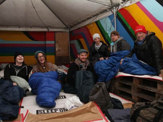 Sleepers prepare to brave the cold and rain. Photo: Roundabout