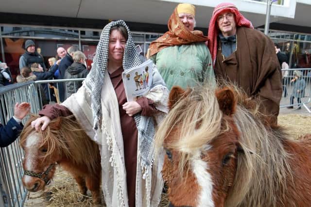 Sheffield Christmas Lights switch on 2016. The Moor. Pictured from local churches areElaine Cox, Della Smithson, and David Cox who performed a live nativity on The Moor.