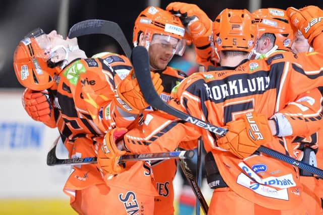 Sheffield Steelers players celebrate one of five goals against Belfast Gaints - Pic: Dean Wooley