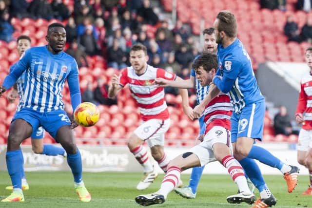 John Marquis battles for possession.