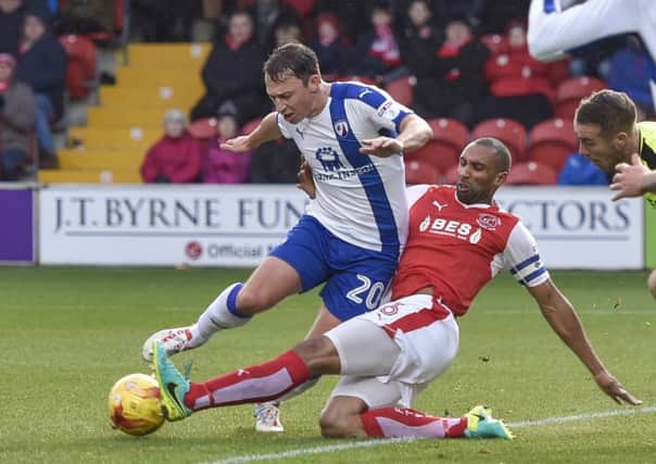 Chesterfield's Kristian Dennis is tackled in the box. Picture by Steve Flynn/AHPIX.com.