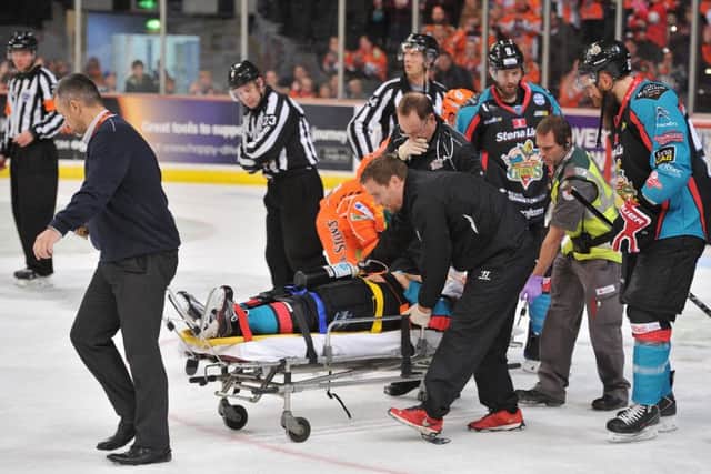 Belfast Giants' David Rutherford is taken off on a stretcher with a neck injury