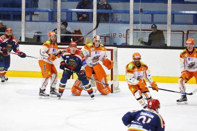 Sheffield Steelers defending in the first match of the season against Edinburgh Capitals - Yared Hagos in the foreground