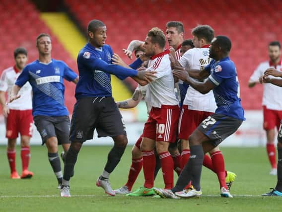 Would-be team mates Leon Clarke and Billy Sharp get involved in a scrap when Bury last came to Bramall Lane