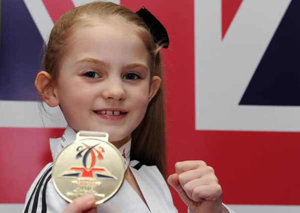 Caitlin Gillott, nine, became the british national champion in taekwondo. Picture: Andrew Roe