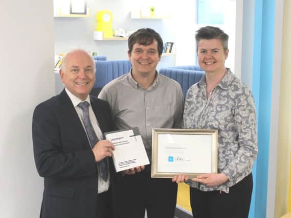 Sheffield Hallam University's director of estates and facilities Mark Swales receives the Leesman+ award alongside project manager John McNamara and estates development officer Sinead O'Toole.