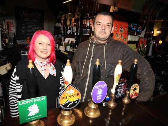 Mandy Billings and Jon Terry behind the bar at The White Lion, in Heeley