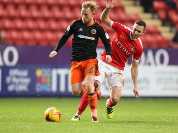 Charlton's Andrew Crofts tussles with Sheffield United's Mark Duffy