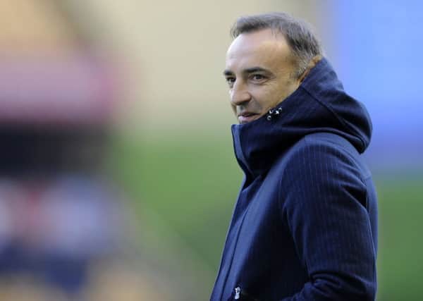 Carlos Carvalhal wraps up from the Winter cold at Wolverhampton....Pic Steve Ellis