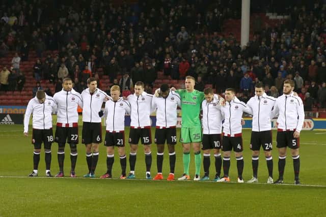 Sheffield United take part in a minutes silence for Brazilian club Chapecoense who were involved in a plane crash
