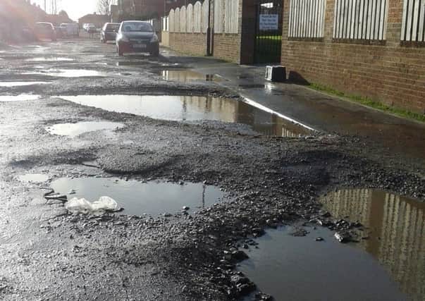 Morley Place in Conisbrough is in a terrible state with a number of large potholes.