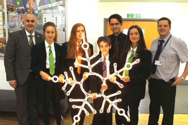 Pupils from Penistone Grammar School with their star, which will be lit up today at the Children's Hospital for Christmas