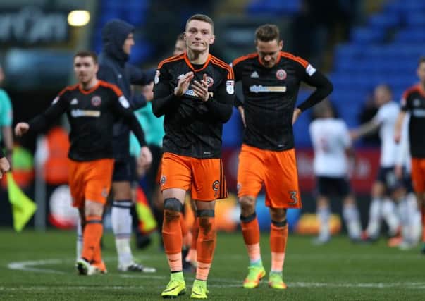 A dejected Caolan Lavery of Sheffield Utd leads the players in applauding the fans during the FA Cup Second round match at the Macron Stadium, Bolton. Picture date: December 4th, 2016. Pic Simon Bellis/Sportimage