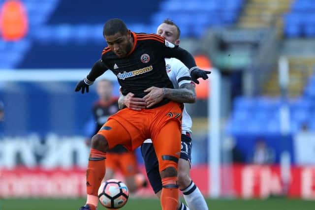 Leon Clarke of Sheffield Utd held by David Wheater of Bolton during the FA Cup Second round match at the Macron Stadium, Bolton. Picture date: December 4th, 2016. Pic Simon Bellis/Sportimage