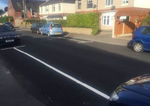 The parking line painted in the wrong place,partly covering Michael Kevans driveway