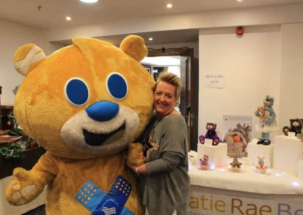 Katherine Hallam with Sheffield Children's Hospital charity bear mascot, Theo