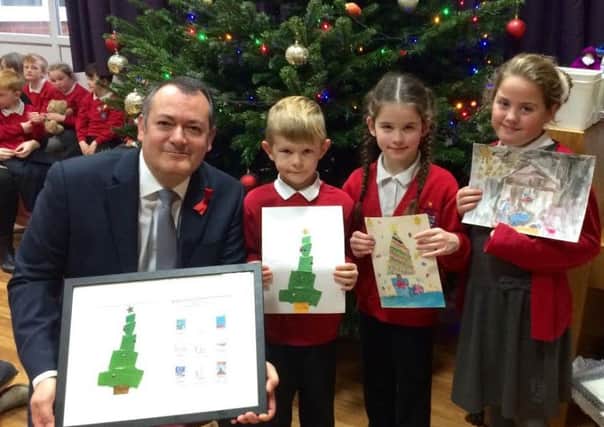 Michael Dugher MP with creative pupils who designed his official Christmas card.