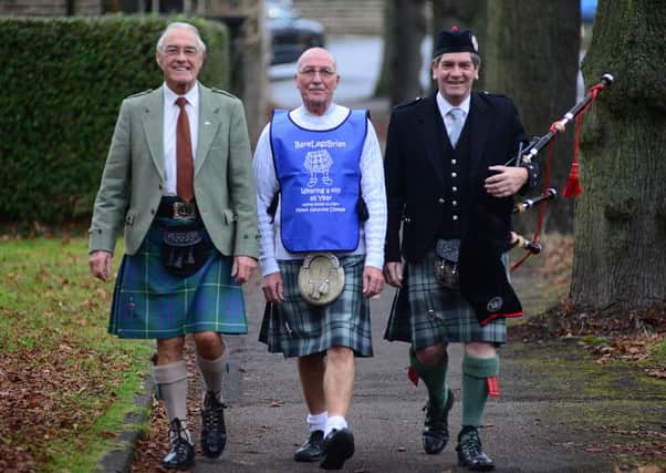 Brian Jackson is fundraising to fight Motor Neurone Disease by wearing a kilt every day in 2017. Brian is pictured withy Lawrie Sutcliffe from Yorkshire Kilts and Ian Duffy from The City of Sheffield Pipe Band. Picture Scott Merrylees