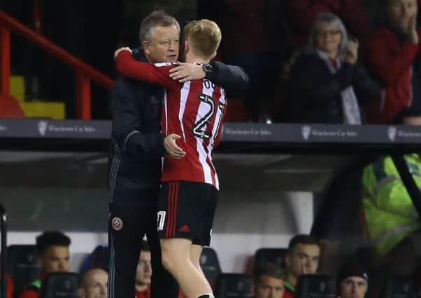 Chris Wilder manager of Sheffield Utd greets Mark Duffy of Sheffield Utd as he substitutes him during the English League One match at Bramall Lane Stadium, Sheffield. Picture date: December 10th, 2016. Pic Simon Bellis/Sportimage