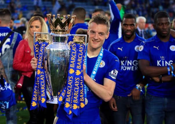 Jamie Vardy with the Premier League trophy he won at Leicester City last season