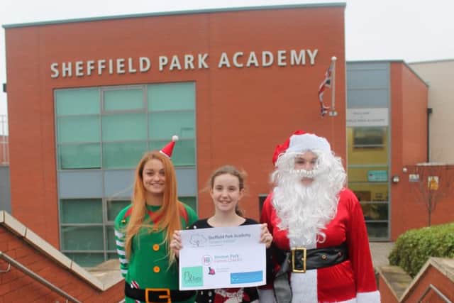 Storm Burgess reseives cheque for animal charities
