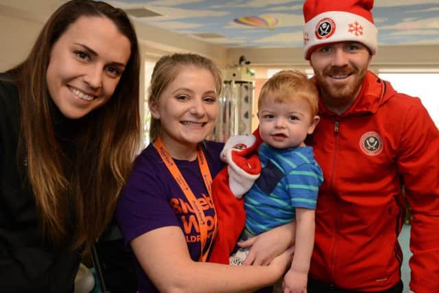 Sheffield United Ladies captain Rosa Neary with student nurse Lucy Hallsworth, Layton and Blades midfielder John Fleck at Bluebell Wood Children's Hospice