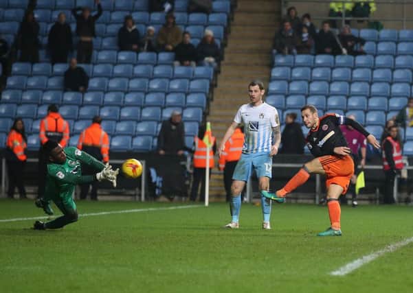 Billy Sharp of Sheffield Utd scores the second goal past Reice Charles Cook of Coventry City during the English League One match at the Rioch Arena Stadium, Coventry. Picture date: December 15th, 2016. Pic Simon Bellis/Sportimage