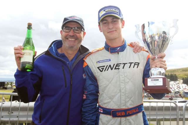 Sebastian Perez (Chesterfield) winner of the Simpson Race Products Ginetta Junior Championship race round 15 for Dronfields JHR Developments team at the Scottish Knockhill circuit, together with his proud father, Steve Perez.