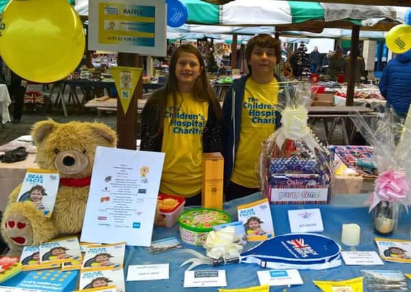 Hannah and Ben Chappell on their charity stall.