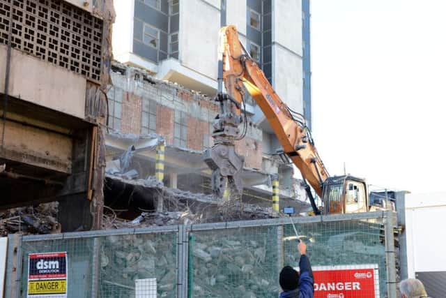 An onlooker captures the demolition of the Grosvenor House Hotel.