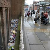Piles of litter thrown down by a wall near to the old Town Hall just yards from a bin in Sheffield city centre