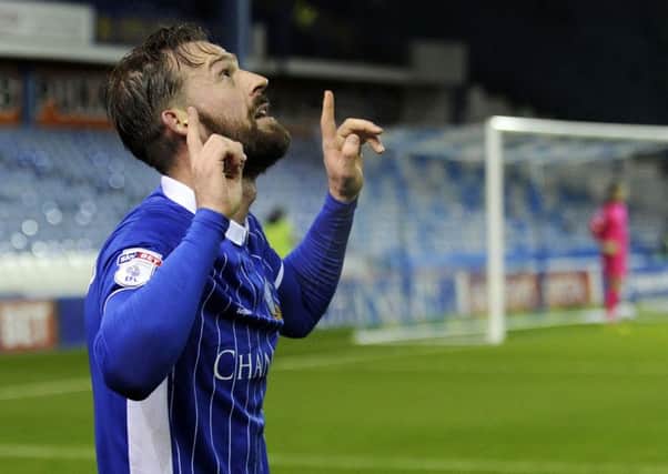 Steven Fletcher celebrates after netting from the spot against Rotherham United
