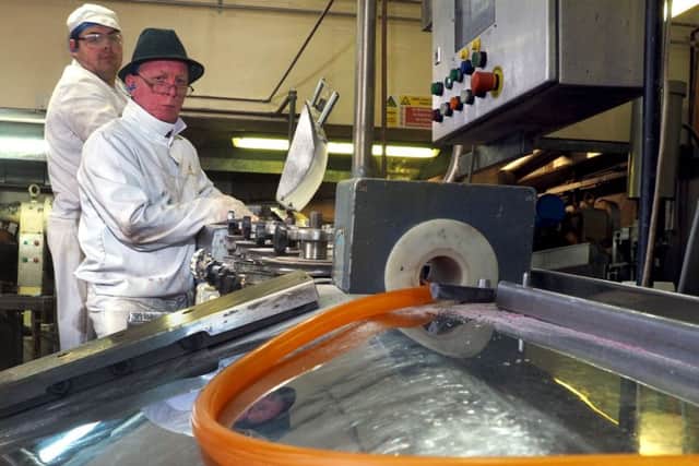 Simpkins Travel Sweets: watching a length of rolled out sweet mixture come out onto the production line