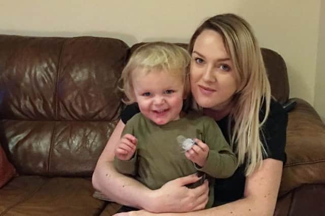 Noah Oxley, who survived falling from a bedroom window, with mum Emma