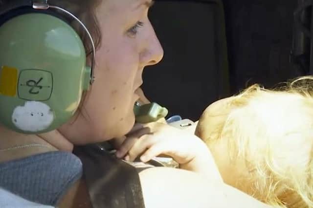 Noah in the helicopter with his mum