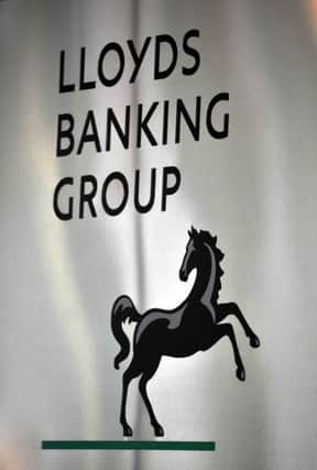 File photo of a sign for Lloyds Banking Group, which has snapped up credit card firm MBNA in Â£1.9 billion deal, the company said. PRESS ASSOCIATION Photo. Photo : John Stillwell/PA Wire