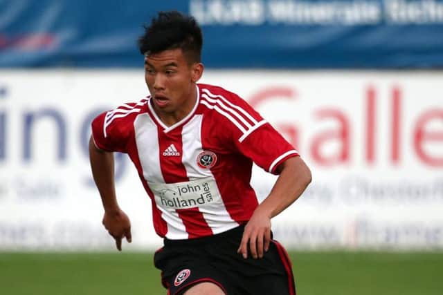 Burmese refugee Kler Heh playing for the Sheffield United youth team.
