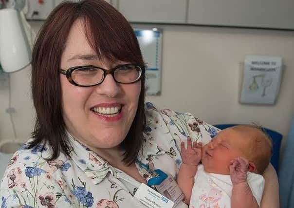 Audra Muxlow, head of midwifery, nursing and professions, with newborn Jessica Morton.