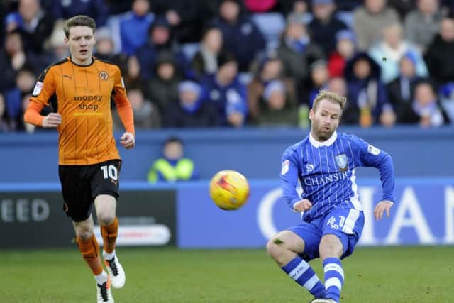 Barry Bannan gets in front of Wolves Joe Mason