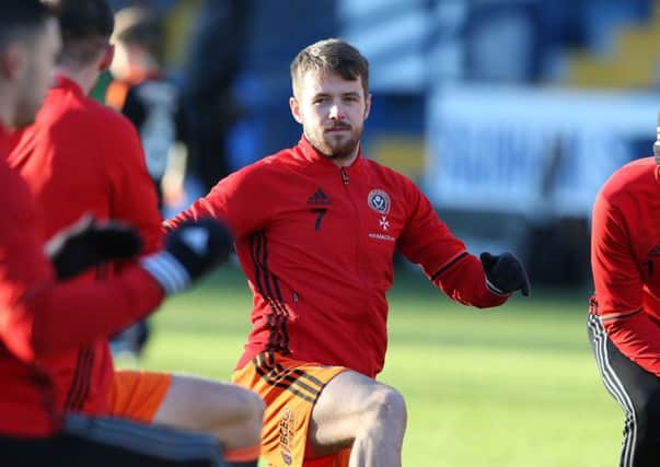 Marc McNulty was back on the bench for United against Bury after being recalled from his loan at Bradford City