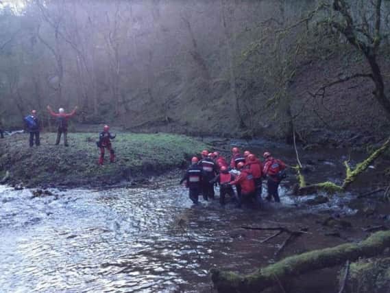 Mountain rescue team volunteers in action at Chee Dale
