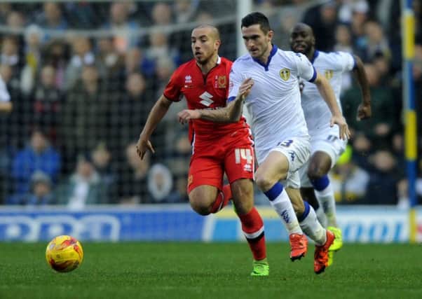 Leeds United v MK Dons.
United's Lewis Cook goes past MK Dons Samir Carruthers.
Picture : Jonathan Gawthorpe