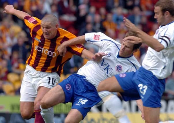 Bradford City v Chesterfield.  28 Aug 2004
Bradfords Dean Windass is thwarted by the joint efforts of Chesterfields  Ian Evatt and Shane Nicholson